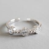 Twisted beads CZ ring in 925 sterling silver, adjustable design featuring sparkling cubic zirconia accents.