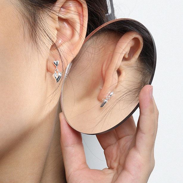 Mini double heart earrings in 925 sterling silver by silverbene, showcasing a romantic design with polished finish.