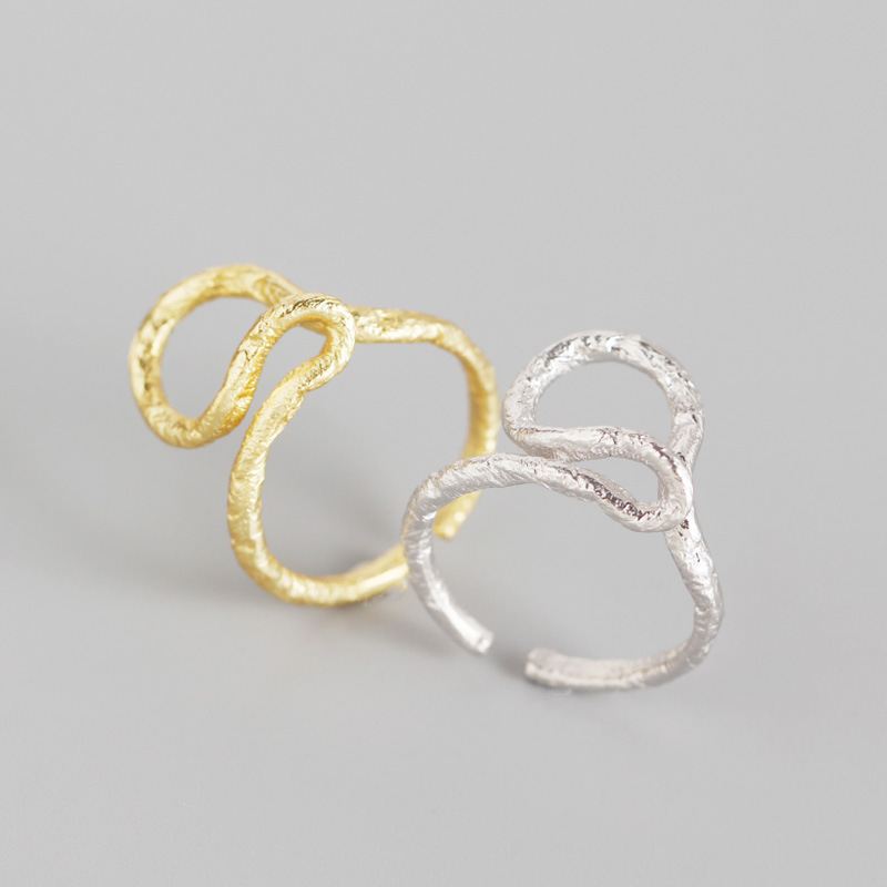 Minimalist silver cross ring in 925 sterling silver, adjustable design by silverbene, showcasing sleek craftsmanship.