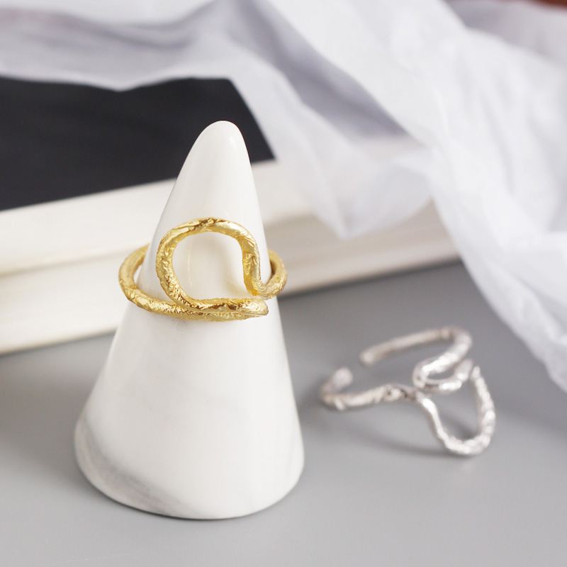 Minimalist silverbene cross ring in adjustable 925 sterling silver, showcasing a sleek and modern design.